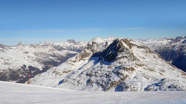 snow mountains ski slope in Switzerland Europe cold sunny day