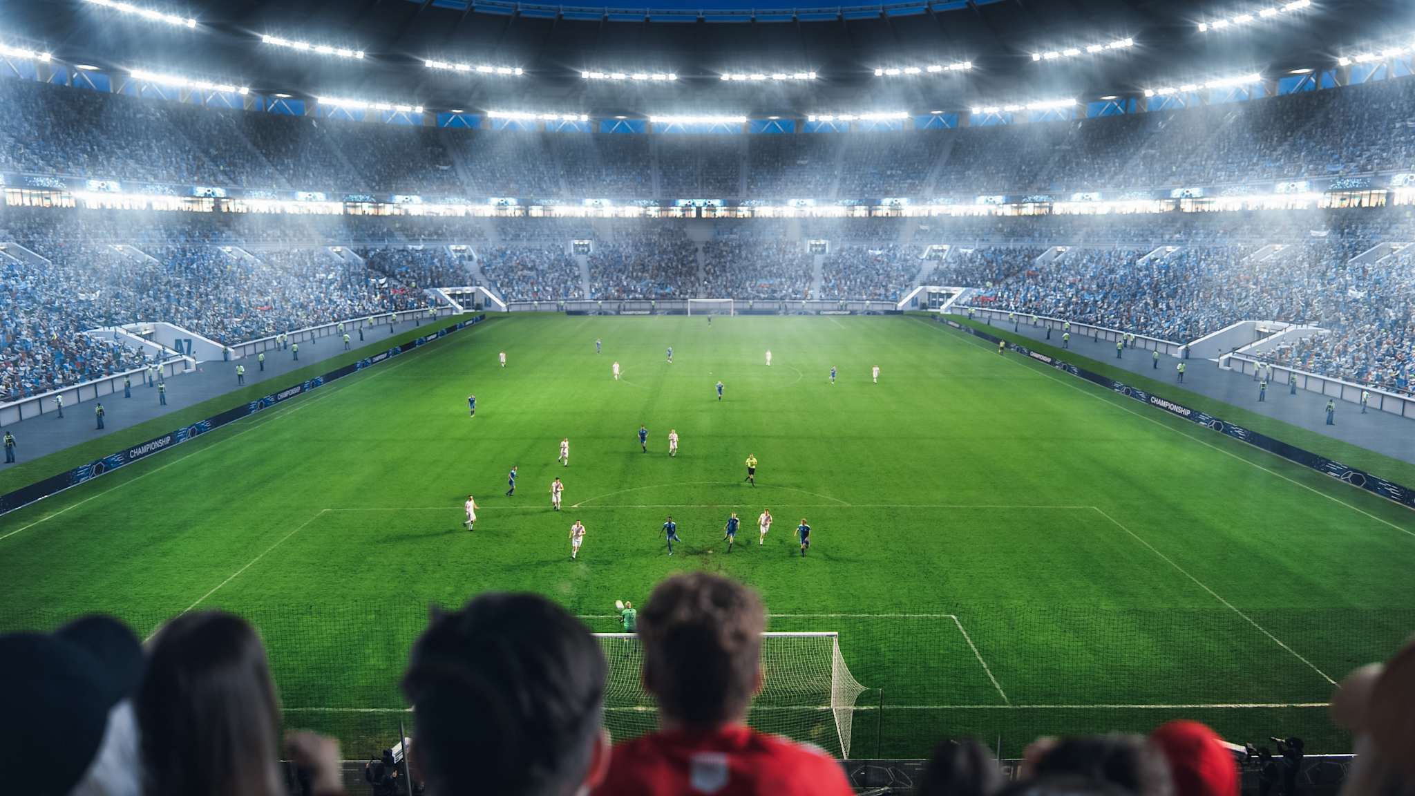 Blick in ein vollbesetzten Fußballstadion während eines Spiels.