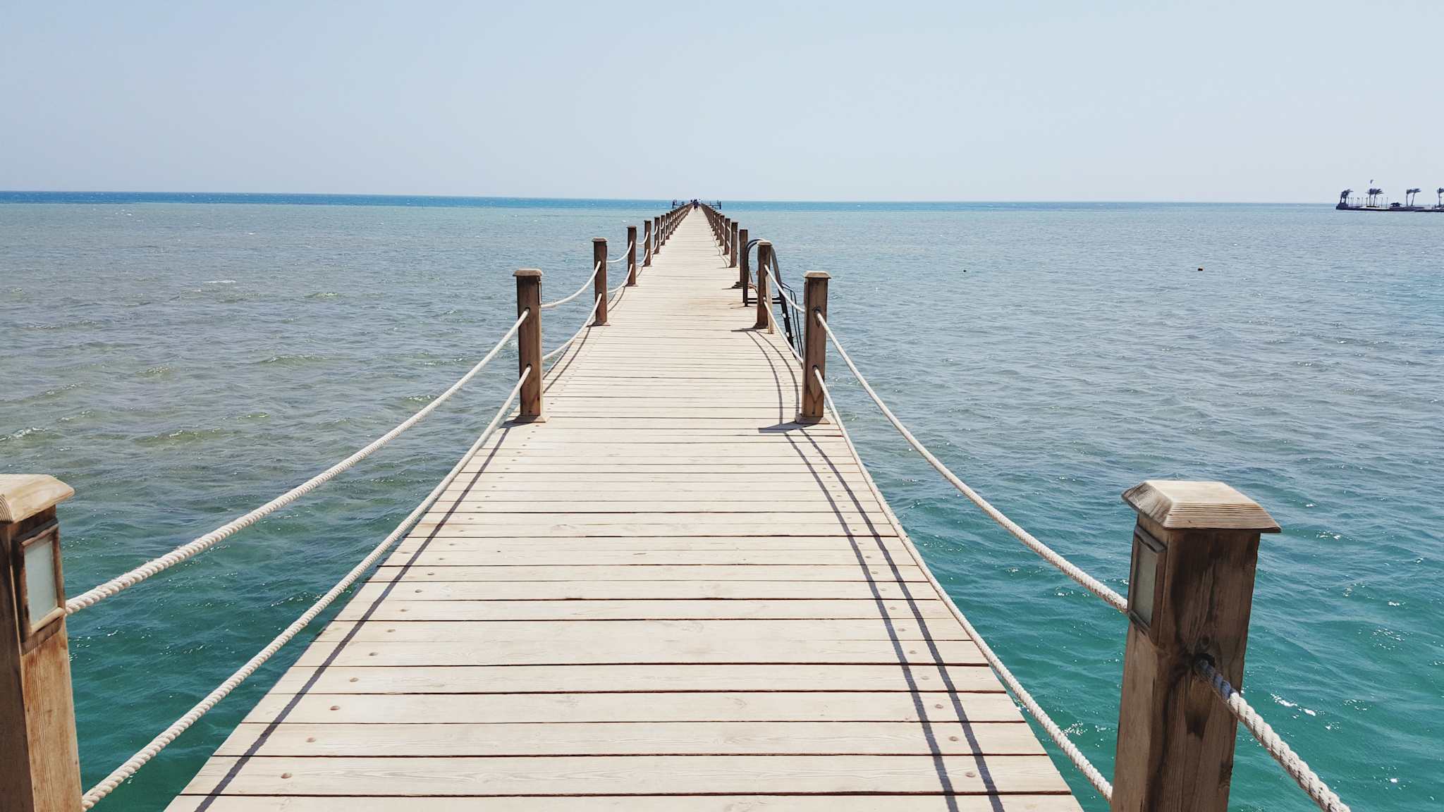 Pier Over Sea Against Clear Sky