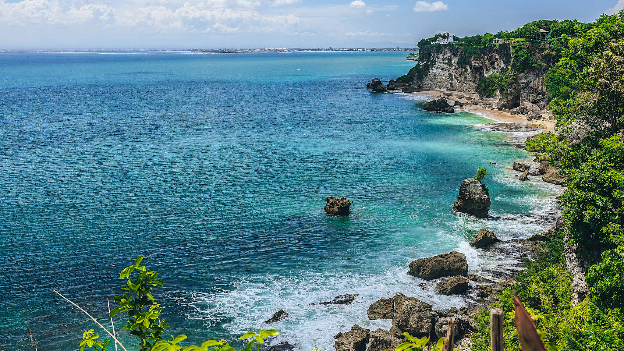 rocky coastline and ocean in Jimbaran, Bali, Indeonesia