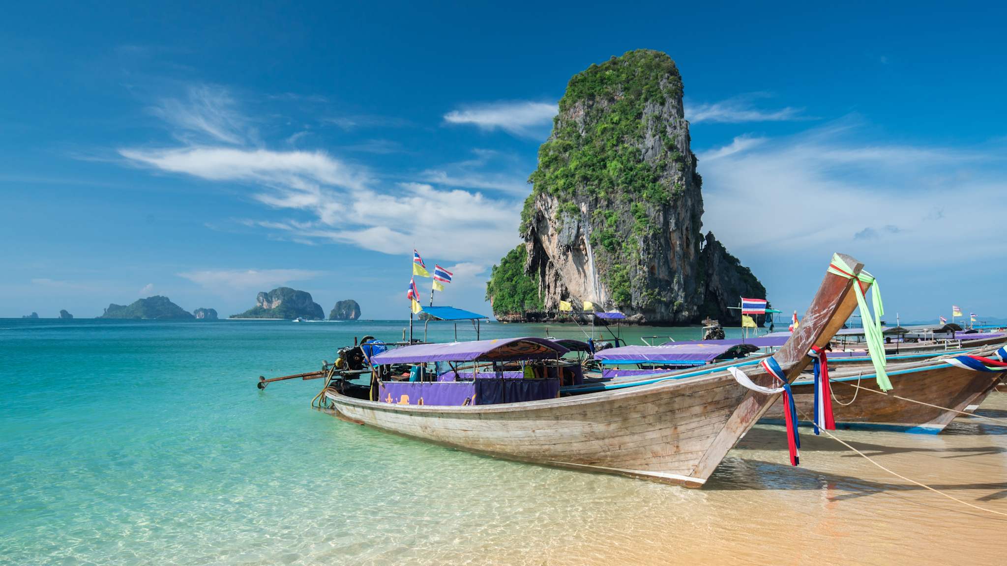Colorful long tail boats at beautiful Ao Nang beach