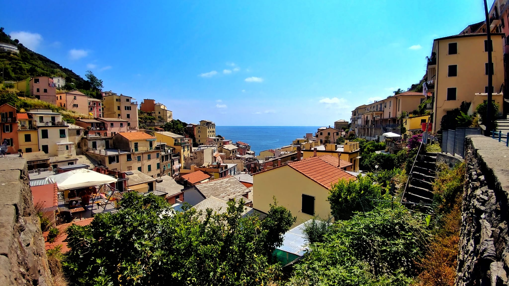 High Angle View Of Houses By Sea Against Sky