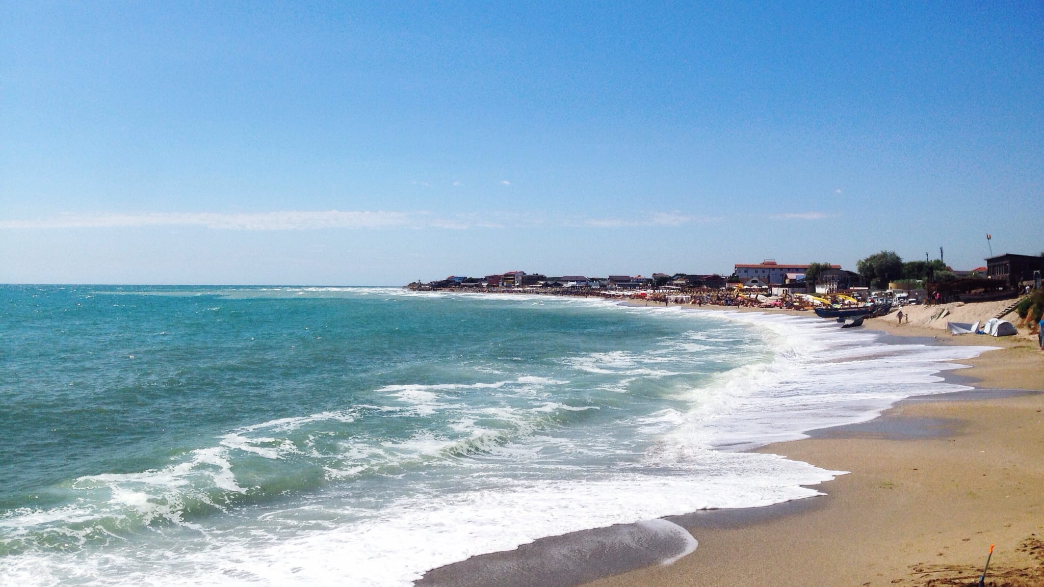 View Of Beach Against Blue Sky