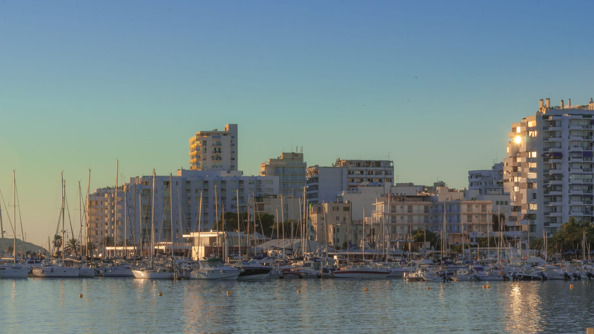 Late afternoon sun marina bay. St Antoni de Portmany, Ibiza,