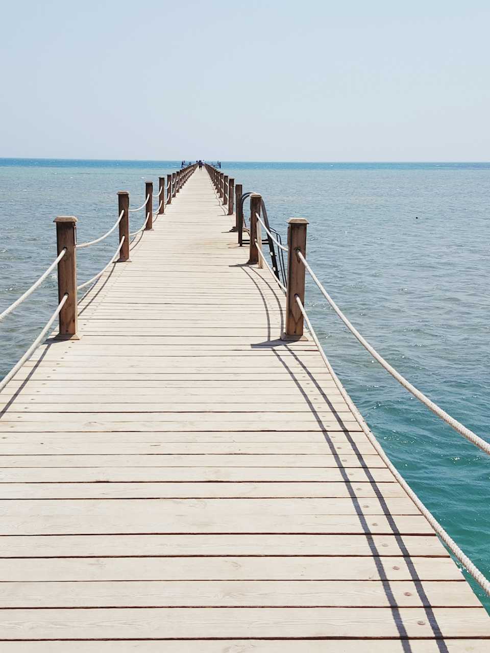Pier Over Sea Against Clear Sky
