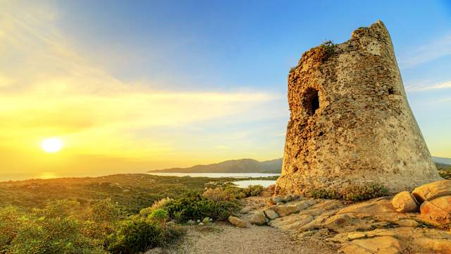 Susnet over old tower of Villasimius, Sardinia