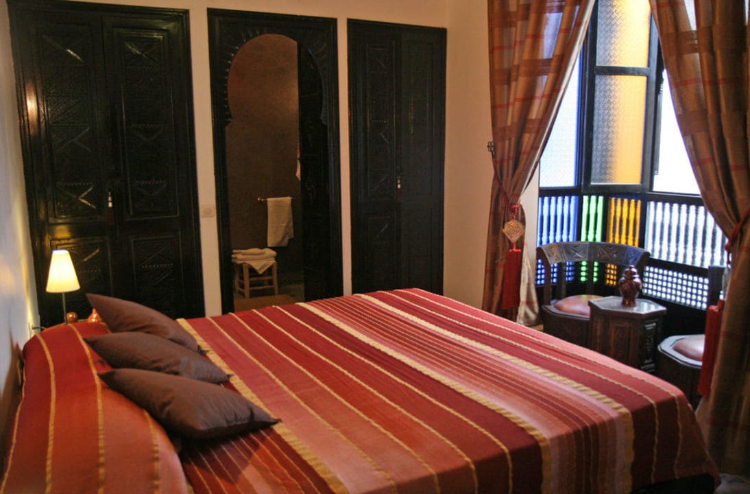 Suite Tchagra avec un lit double Riad Dar Zampa