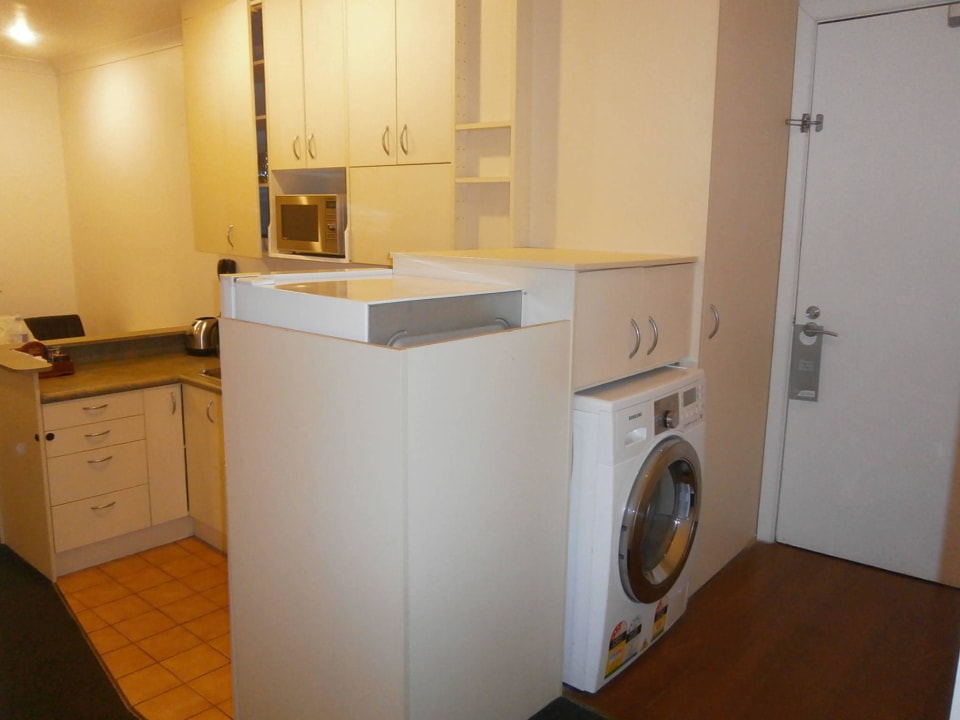 Eingang mit Waschmaschine Quest on Terrace Apartment