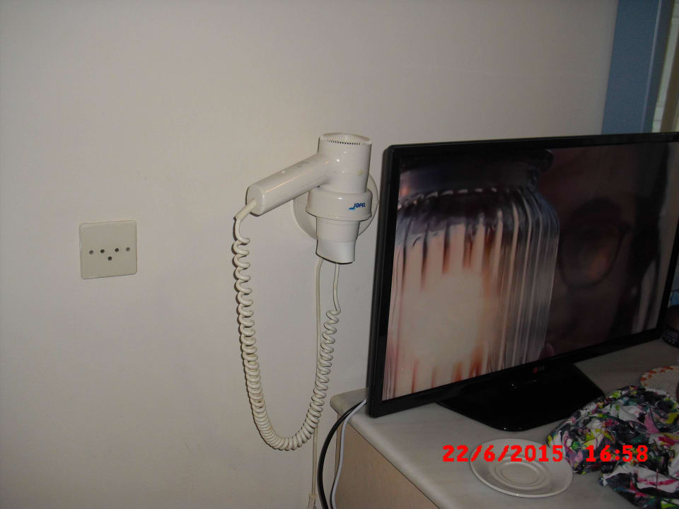 Fön ist hinter dem Fernseher montiert Samian Blue Seaside Hotel