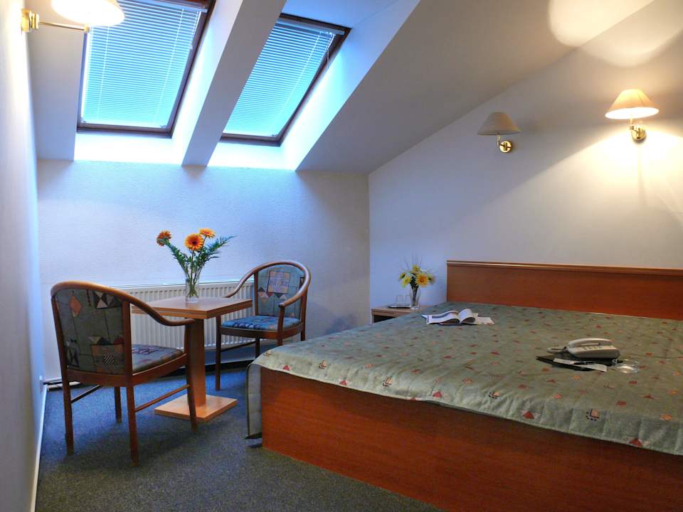 Room with attic window Hotel Amadeus Prague
