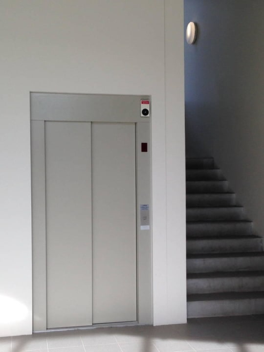 Treppenhaus / Lift Bella Apartments & Rooms