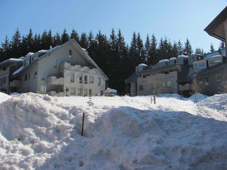 Kopce sněhu a Resident Apartments Resident Harrachov