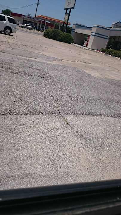 Parking lot tears car up  Hotel Western Inn Pensacola