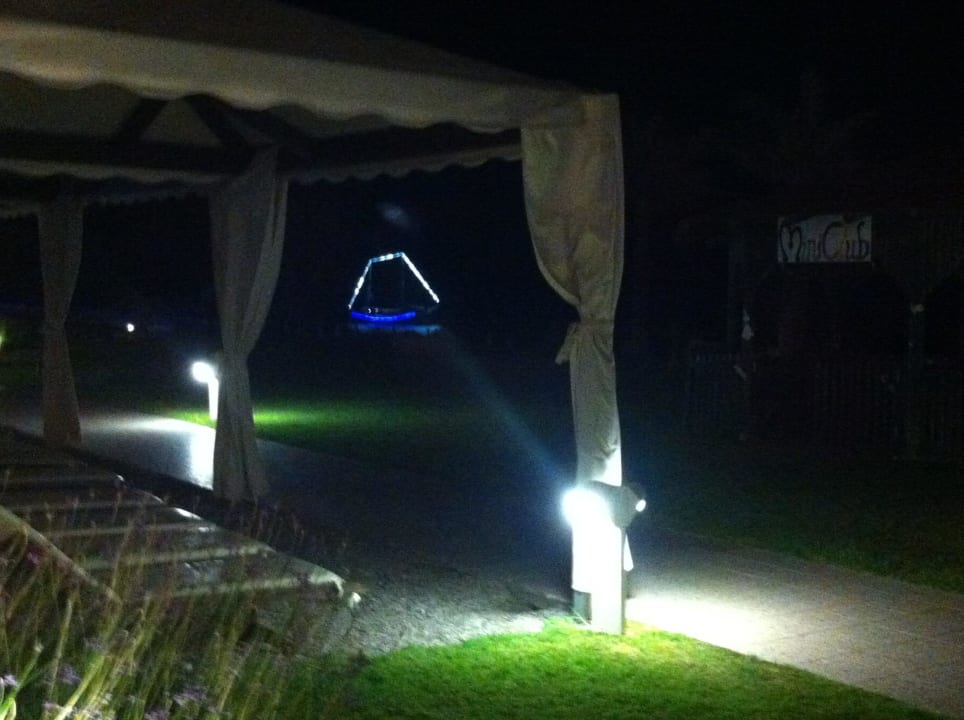 Illuminated boat in night view Rodos Palladium Leisure & Wellness