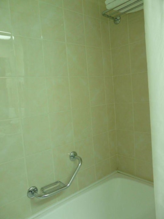 Towels are above bath tub Hotel Proton