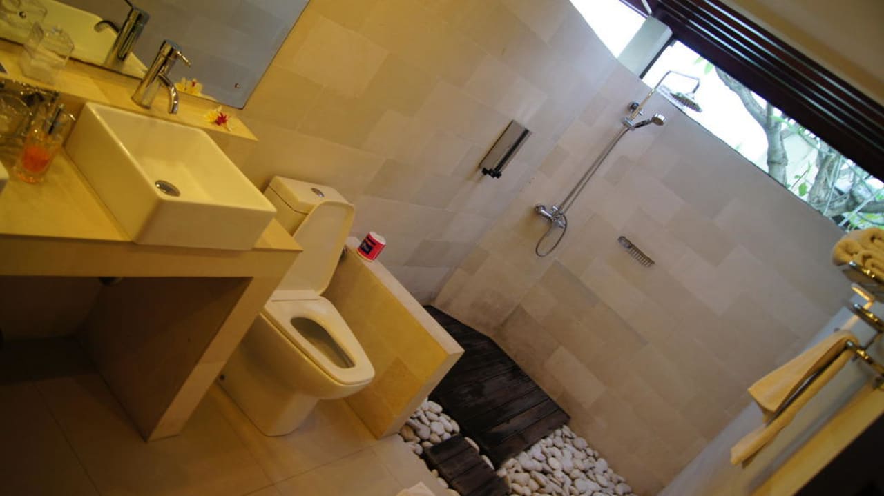 Das Badezimmer Hotel Frangipani Beach Villas