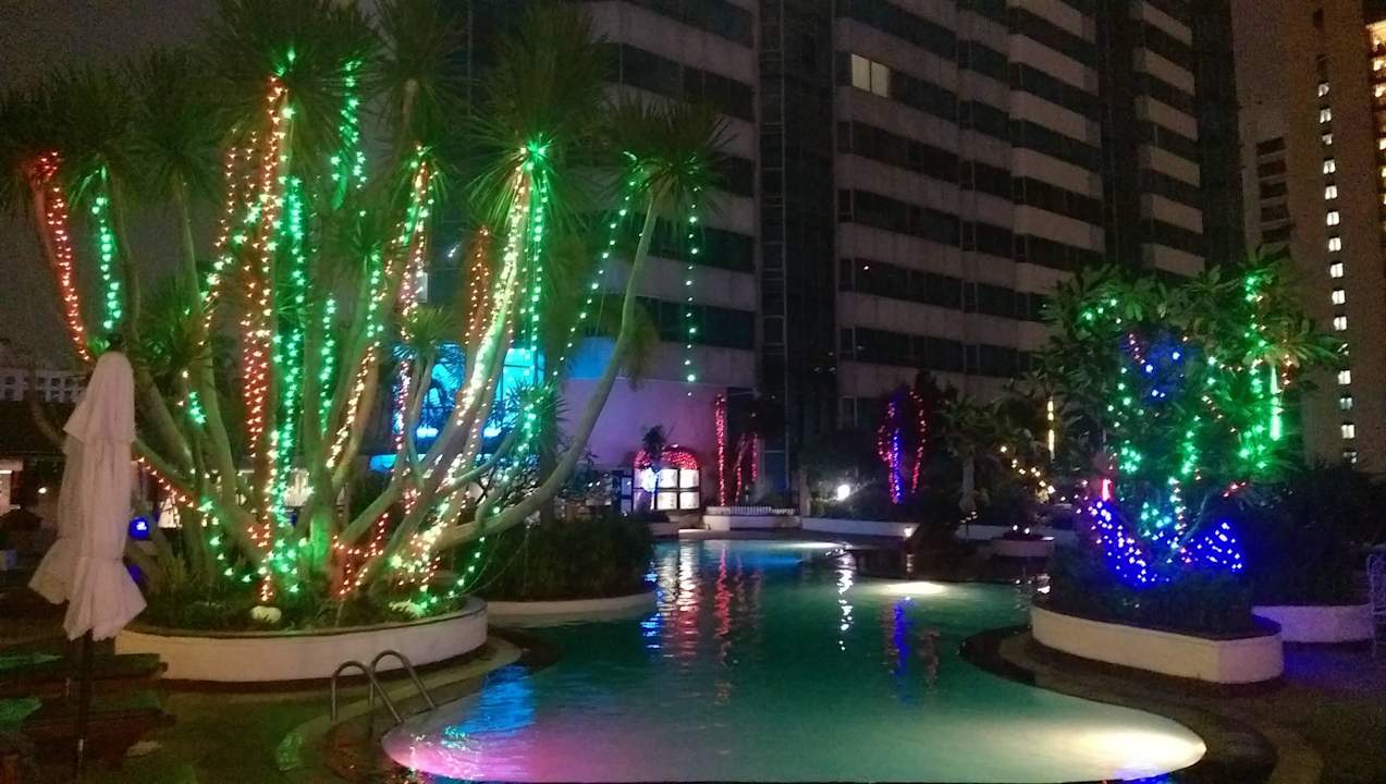 Poolanlage bei Nacht Hotel Windsor Suites & Convention