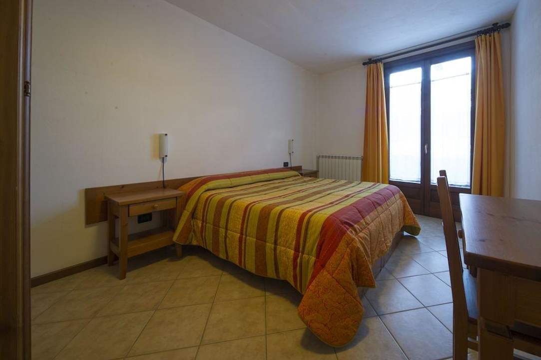 Camera da letto bilo 6 Hotel Residence Chalet della Guida