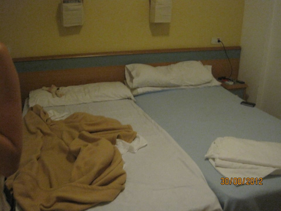 Bett im Zimmer Hotel Green Field