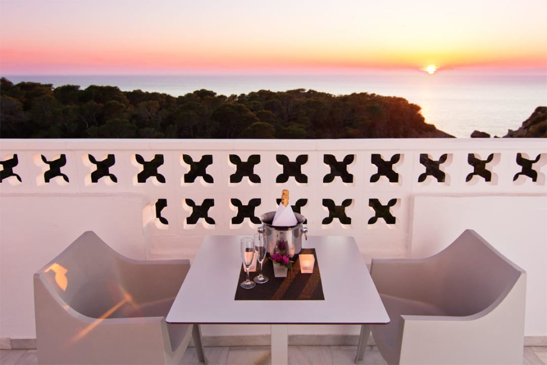 Junior suite balcony with sunset view Hotel Village Ibiza