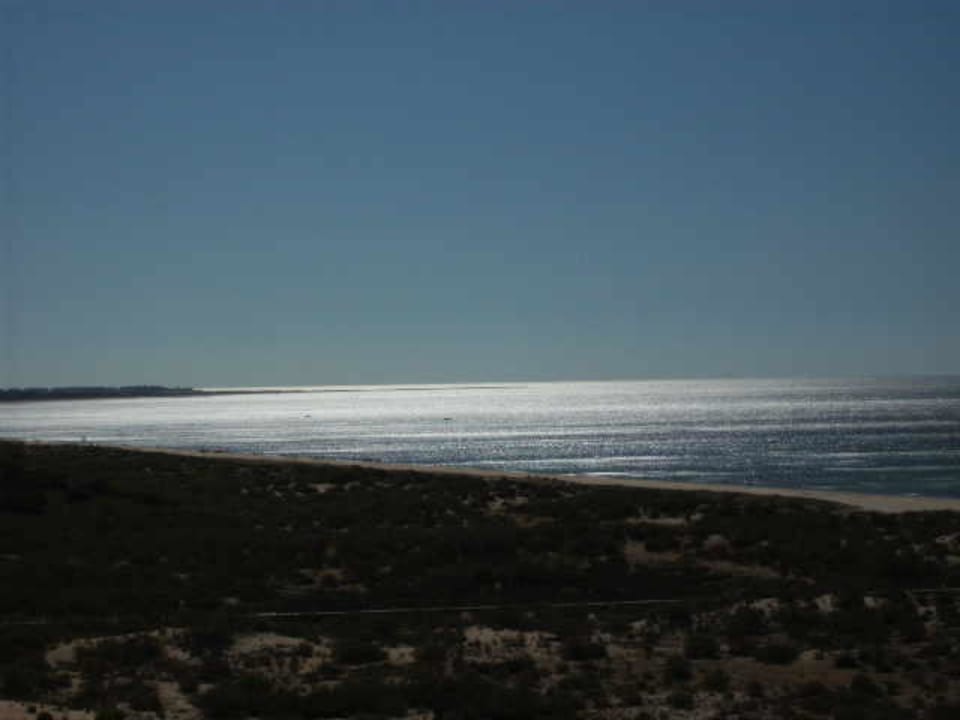 Glitzerndes Meer Ozadi Altura Beach Resort