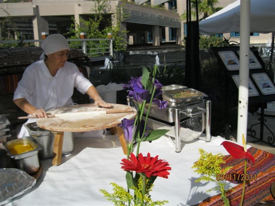 Lady making flatbread Susesi Luxury Resort
