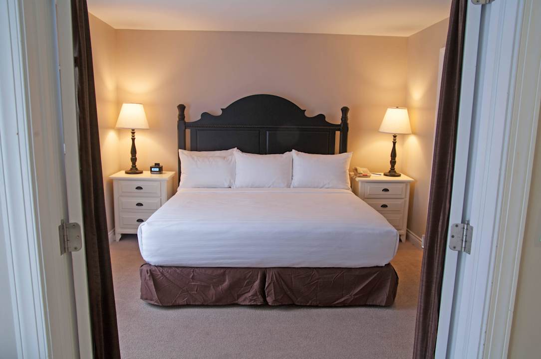 King Suite, Pet Friendly, Lake View - Bedroom Charlevoix Inn & Suites, SureStay Collection by Best Western