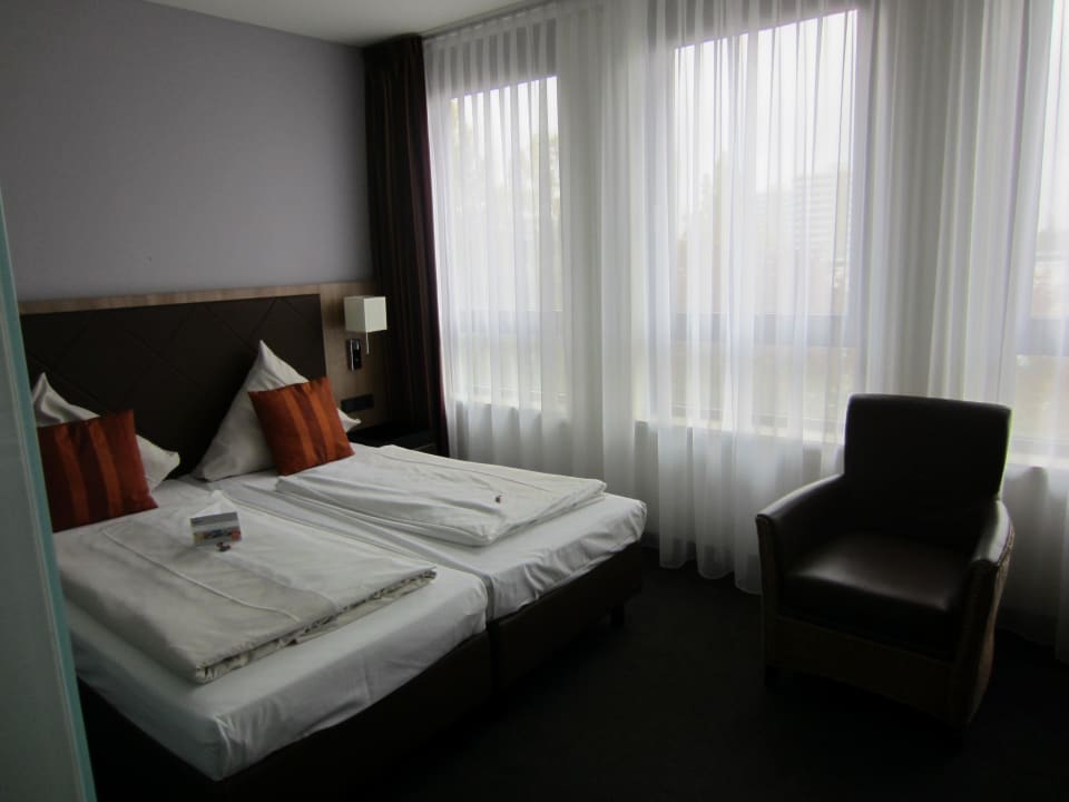 Gemütliches Bett ACHAT Hotel München Süd