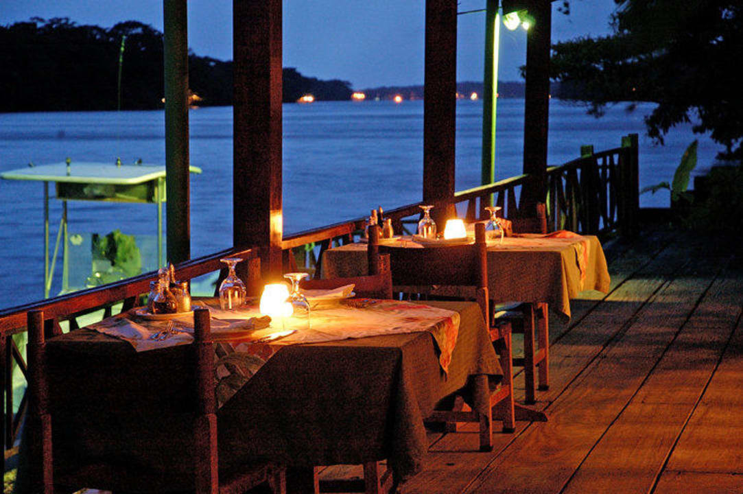 Open air restaurant at night Tortuga Lodge & Gardens