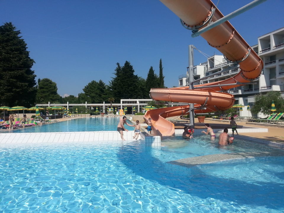 Part of the swimming pool with a waterslide Falkensteiner Club Funimation Borik
