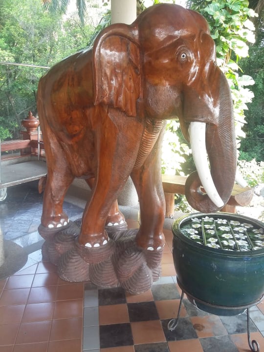 Wooden artwork next to hotel's entrance Hotel Felix River Kwai