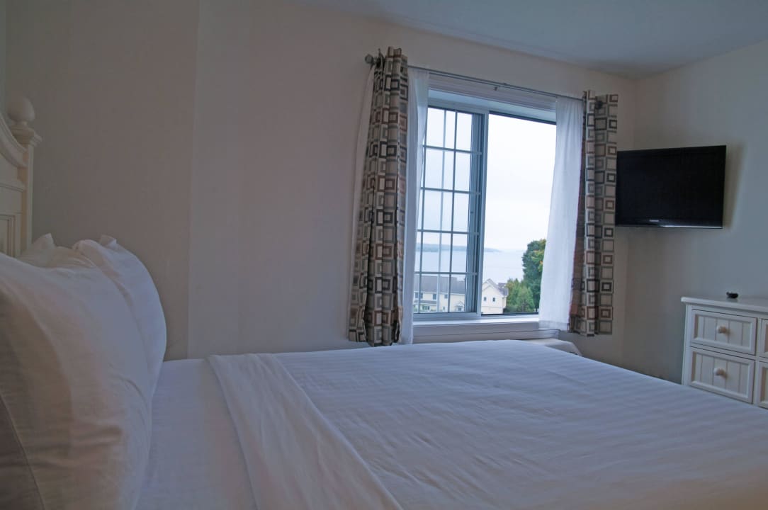 Queen Suite with Lake View - Master Bedroom Charlevoix Inn & Suites, SureStay Collection by Best Western