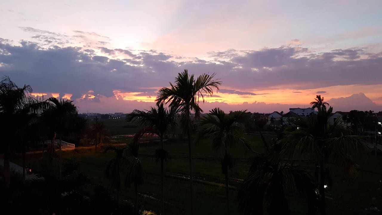 Sonnenuntergang vom Balkon Golden Rice Hotel