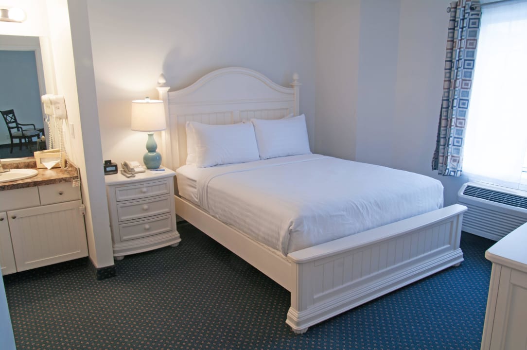 Queen Suite with Lake View - Master Bedroom Charlevoix Inn & Suites, SureStay Collection by Best Western