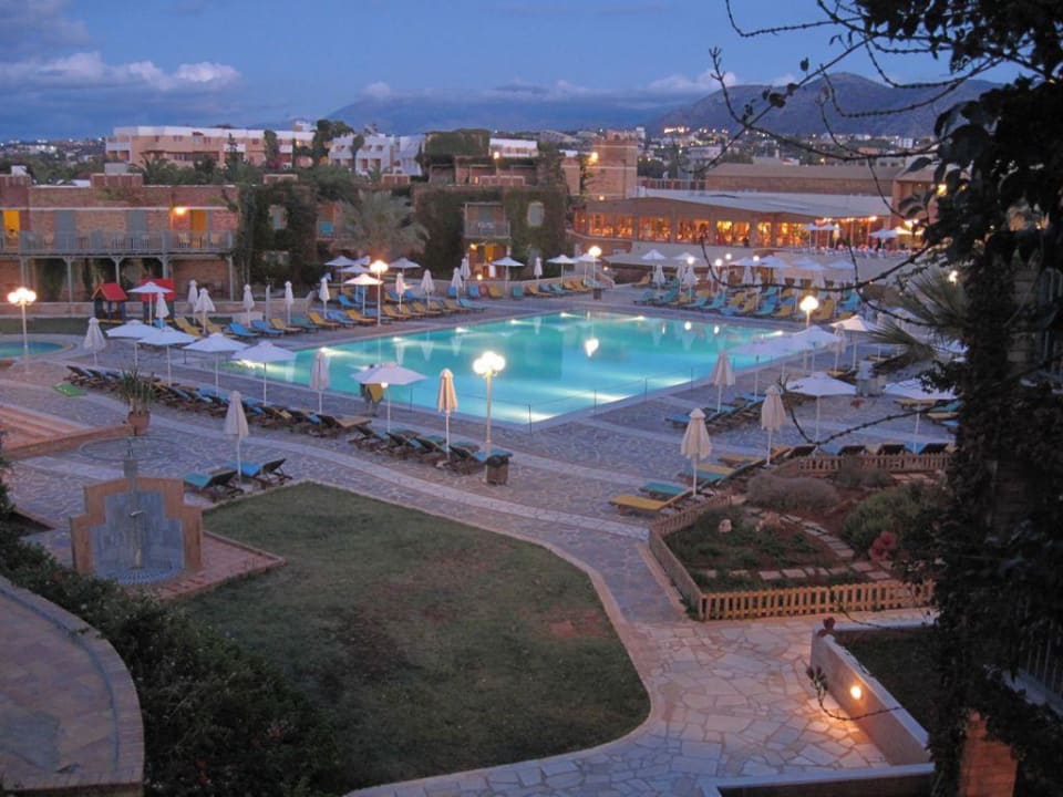 Balcony pool view at dusk Bella Beach Hotel