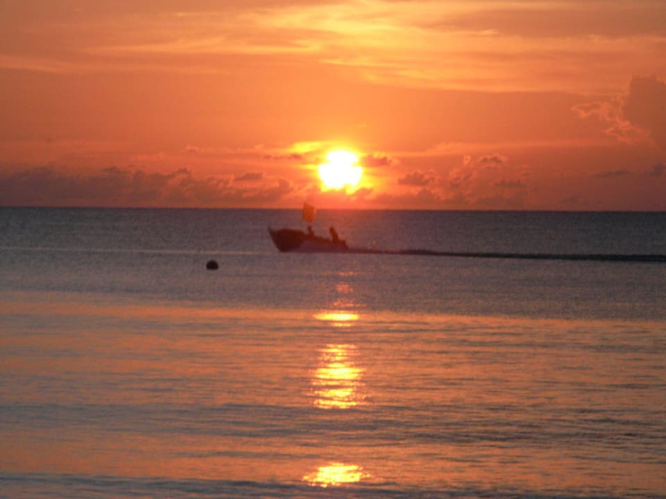 Sunset at the beach Sunset at the Palms Resort - Adults Only