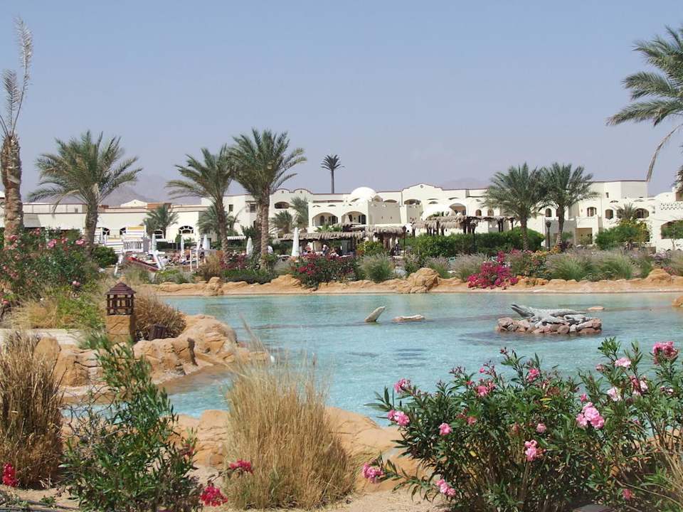 Waterway and hotel in background Regency Plaza Aqua Park & Spa