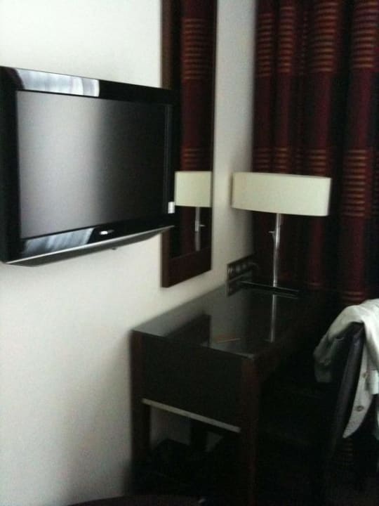 Flatscreen TV and desk of Hotel Astra Opera Paris Hotel Astra Opera Astotel