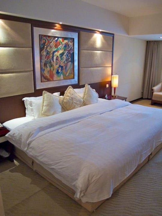 Blick aufs Bett Hotel Chang An Grand