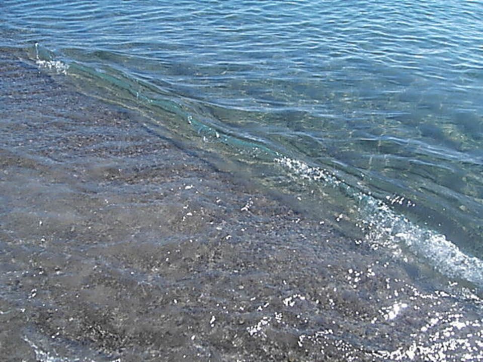 Sand-Kiesstrand Porto Bello Beach