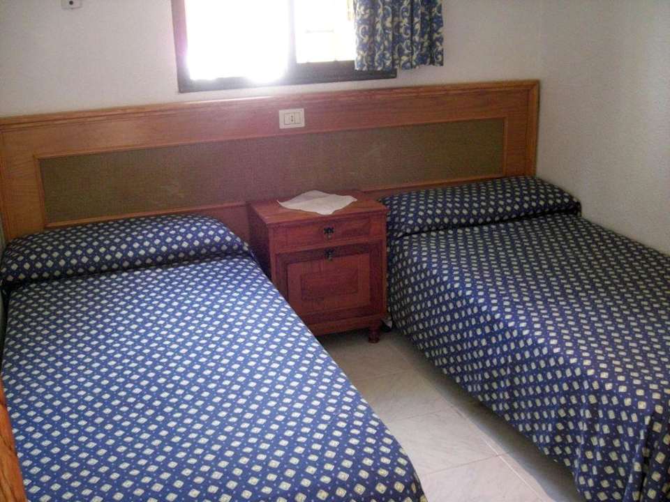 Die Betten im Zimmer HL Miraflor Suites Hotel