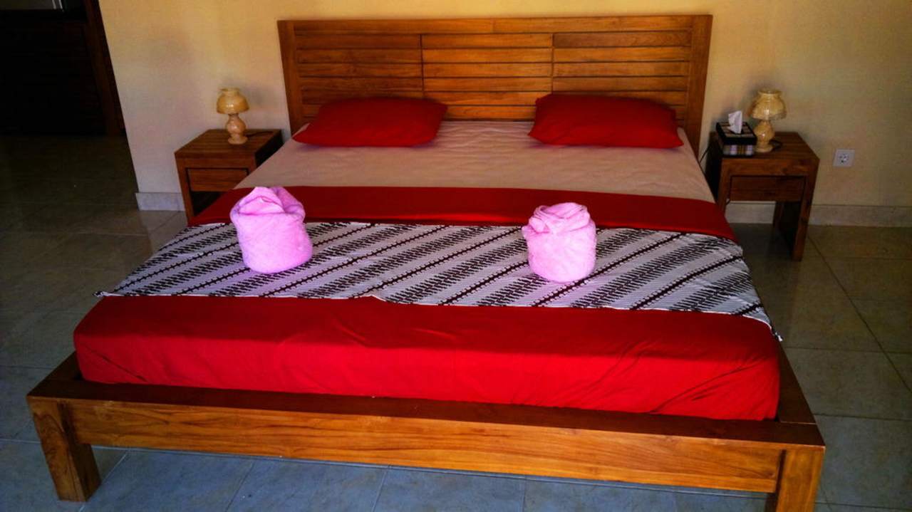 King size bed in standard rooms Hotel Bali Spark Resort Dive & Spa