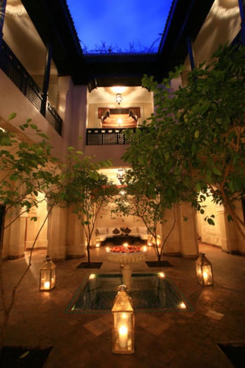 Courtyard 1 at Dusk Hotel Dar Les Cigognes by Sanssouci Collection