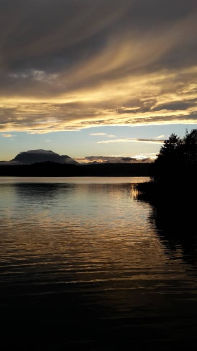 Sonnenuntergang am Bootssteg Naturel Hoteldorf Seeleitn