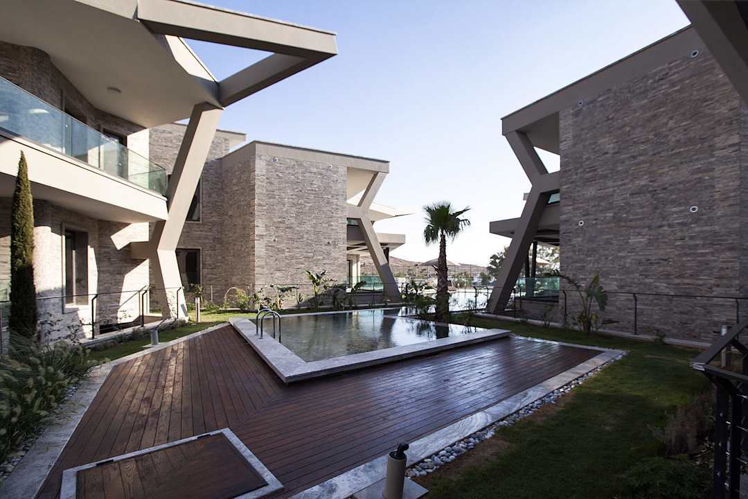 Natural stone coated swimming pools   RetrON Residence