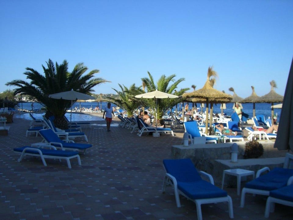 Poolanlage bei Sonnenuntergang Grupotel Aguait Resort & Spa - Adults only