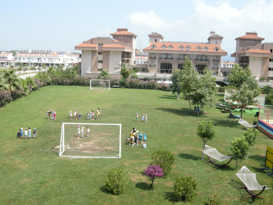 Garden area with fottball field; also Mini Club is Hane Family Resort