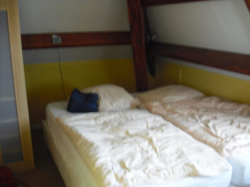 Bett im Studio Pension Villa Tanahlot