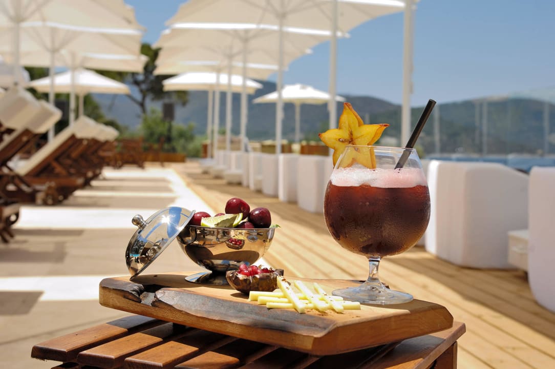 Savour delicious drinks at the pool  Sarpedor Boutique Hotel