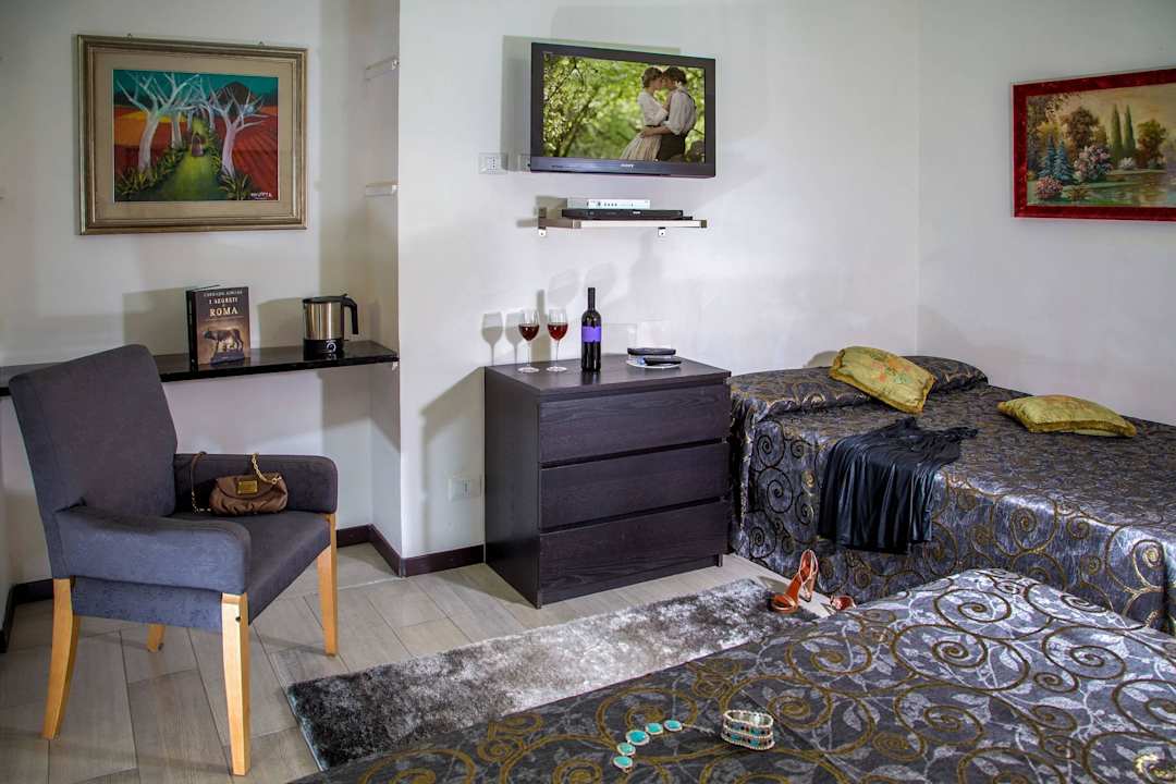 Quadruple Room with Balcony Roma Central Guest House